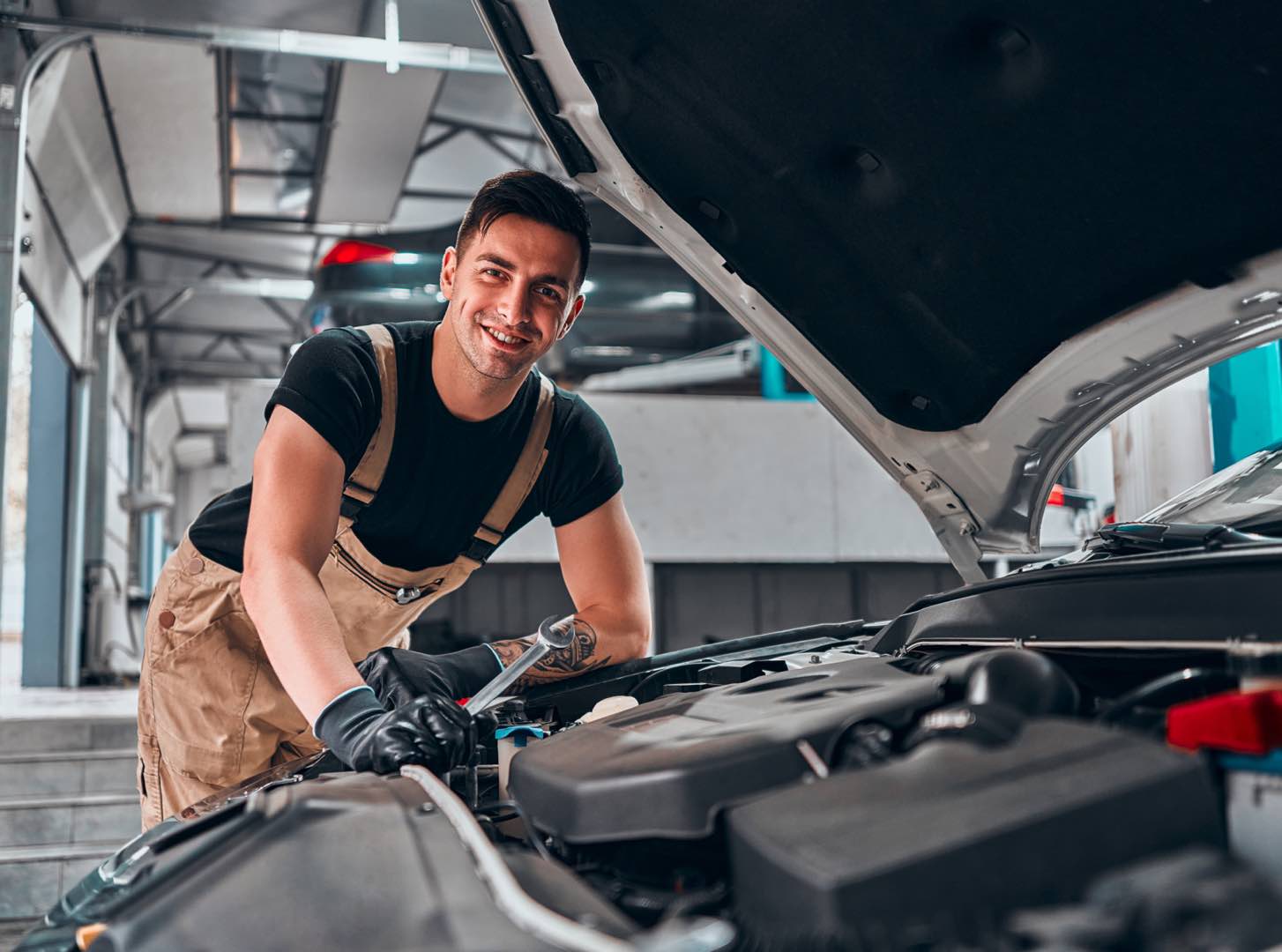 man next to a car